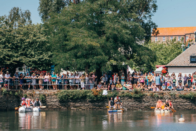 Rafts on the water at Kingsbridge Fair Week's raft race event