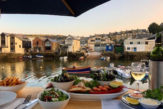 Sunset over Salcombe Harbour from the terrace at Crab Shed Salcombe