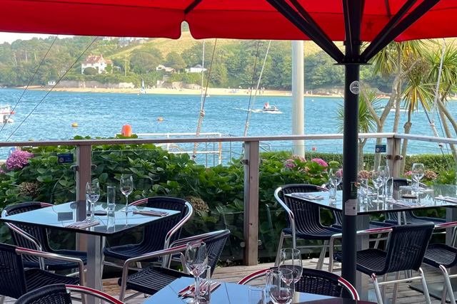 The outdoor seating area overlooking the water at Dick and Wills