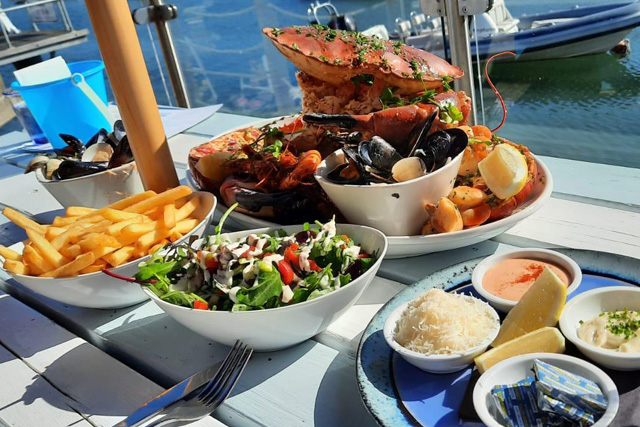 A plate of Salcombe Brown Crab overlooking the harbour at The Crab Shed, Salcombe